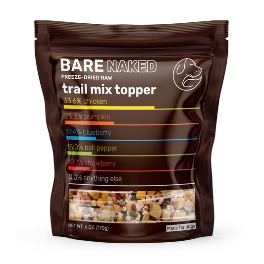 Front view of freeze-dried chicken dog meal mixer in a brown resealable pouch, showing ingredient breakdown and mixed raw pieces through a clear window