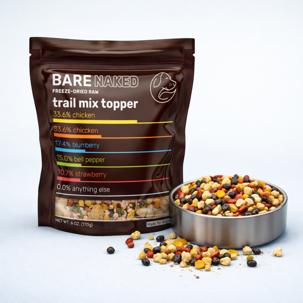 Bag of Bare Naked freeze-dried raw trail mix topper with a bowl of mixed nuts and seeds on a white background